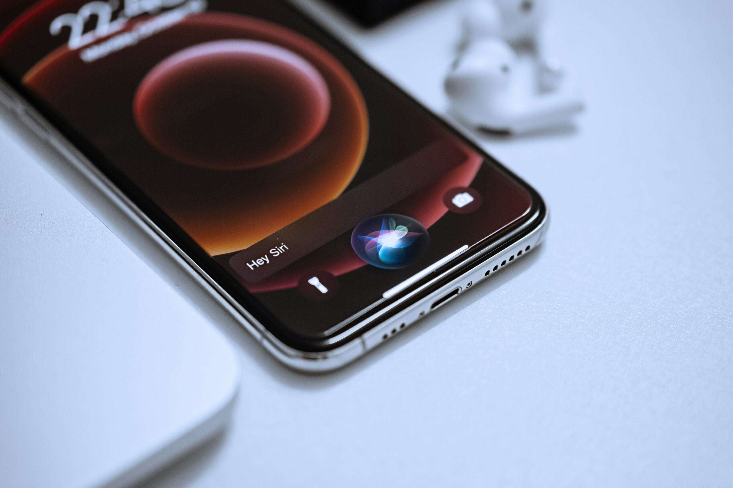 a phone laying on a desk.
