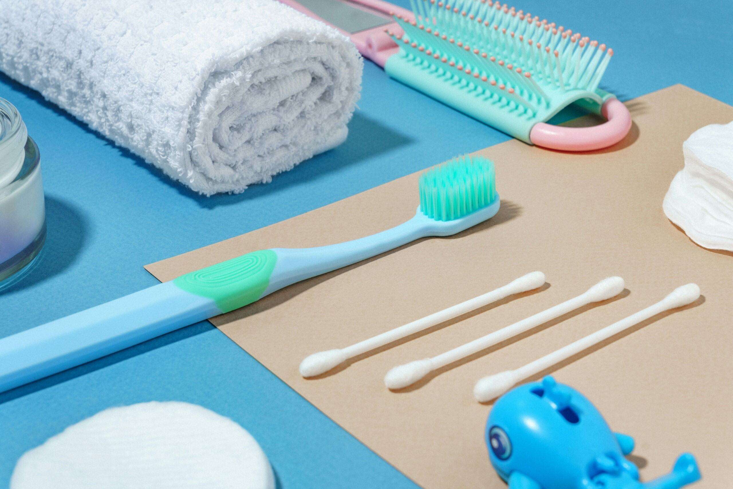 ec02c673-1754-4051-bc3b-d5beca9caea2 Toothbrush and other personal hygiene items laid out.