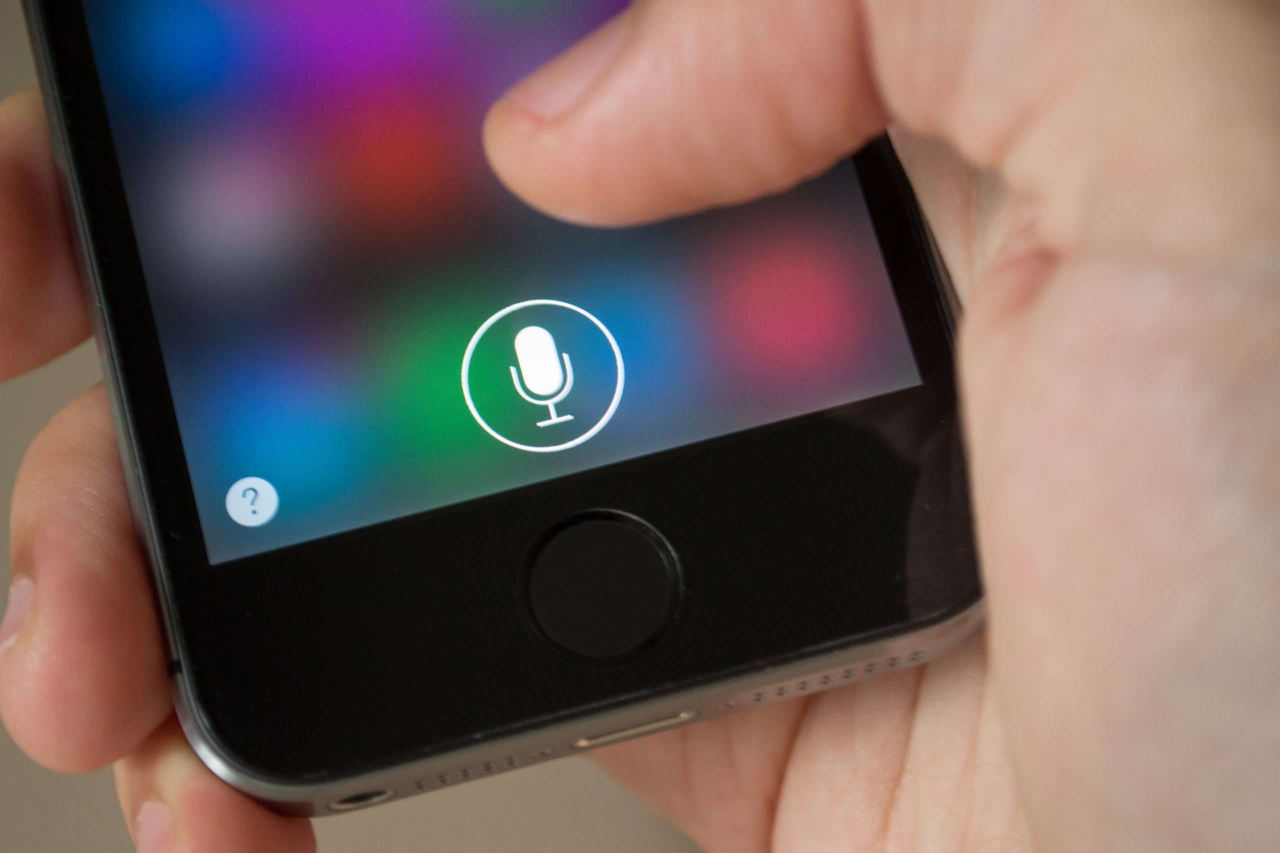 iPhone screen with Siri application icon.